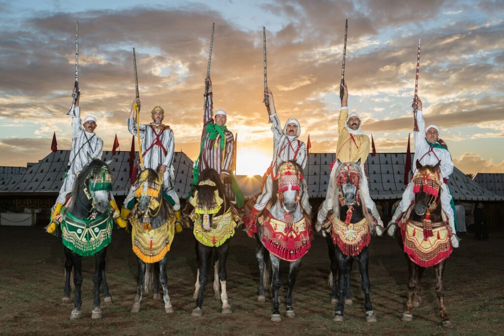 A group of people riding on the backs of horses
