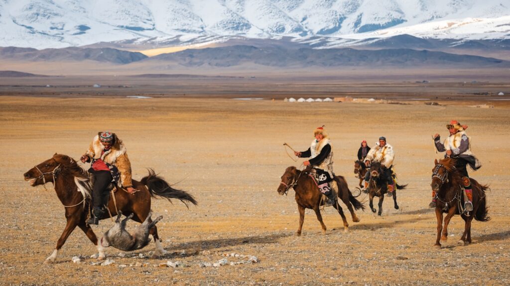 Horse riders compete in an equestrian game.