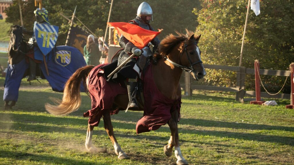 A man riding on the back of a brown horse