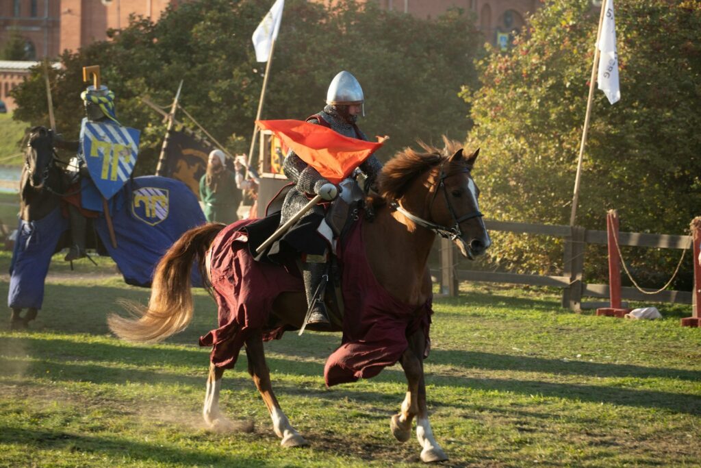 A man riding on the back of a brown horse