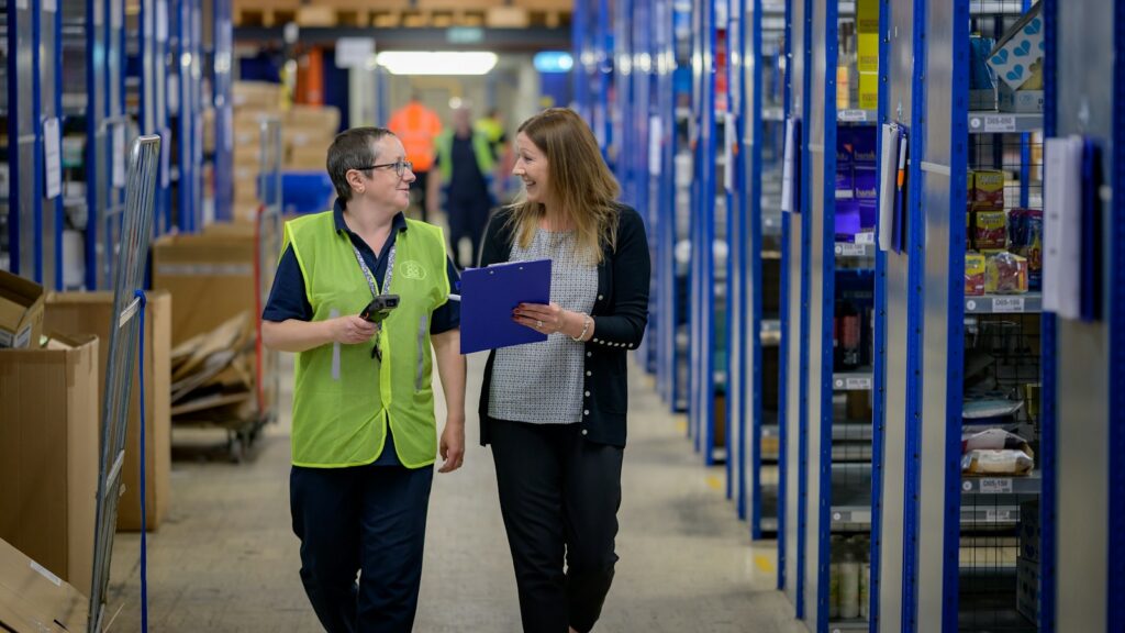 a man and a woman in a warehouse