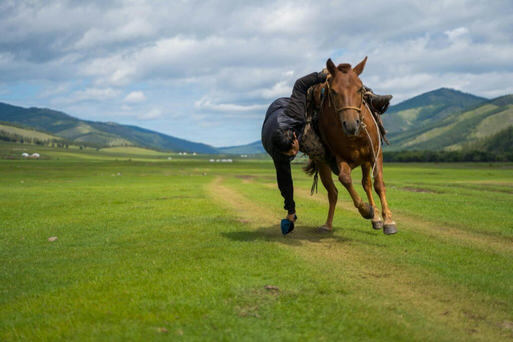 Traditional Mongolian horse racing event in Darkhan, featuring an athletic rider in action.