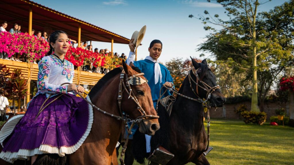 A vibrant traditional Peruvian ceremony featuring riders in cultural attire on horses, captured in Jayanca.