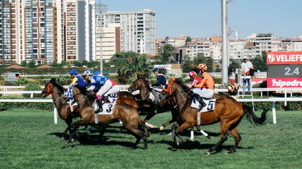 Dynamic horse racing scene with jockeys competing fiercely on a sunny day.