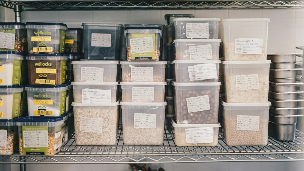a shelf filled with containers and containers of food