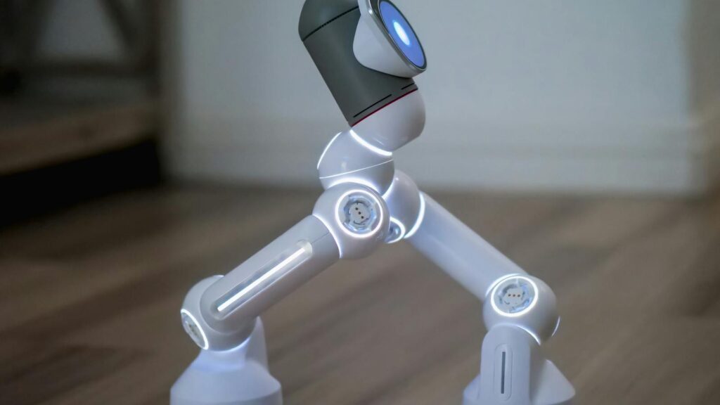 Side view of a modern robot walking on a wooden surface, showcasing advanced technology.