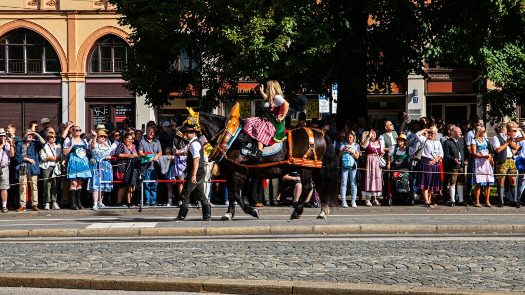 a man riding on the back of a black horse