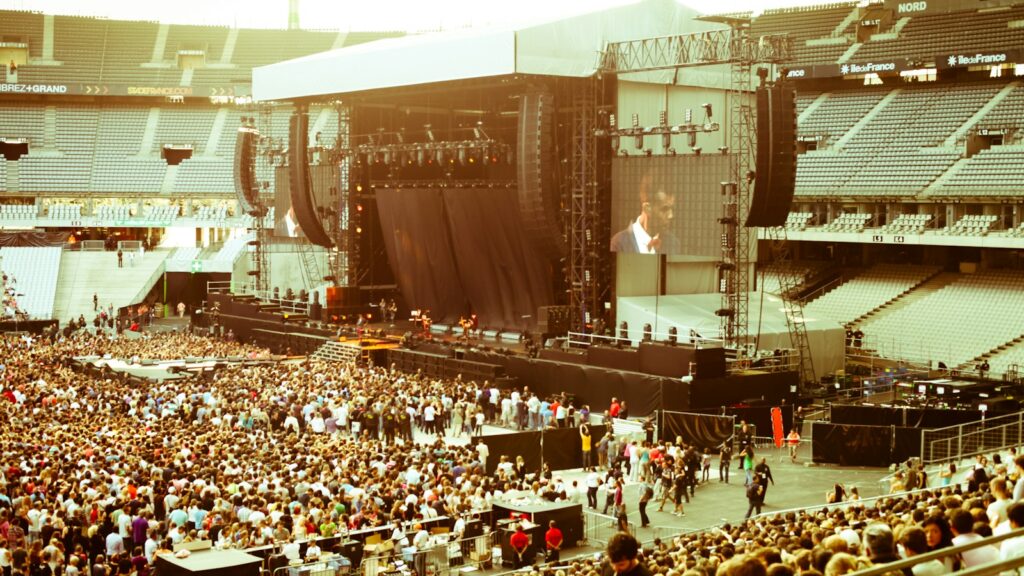 people sitting on chairs inside stadium