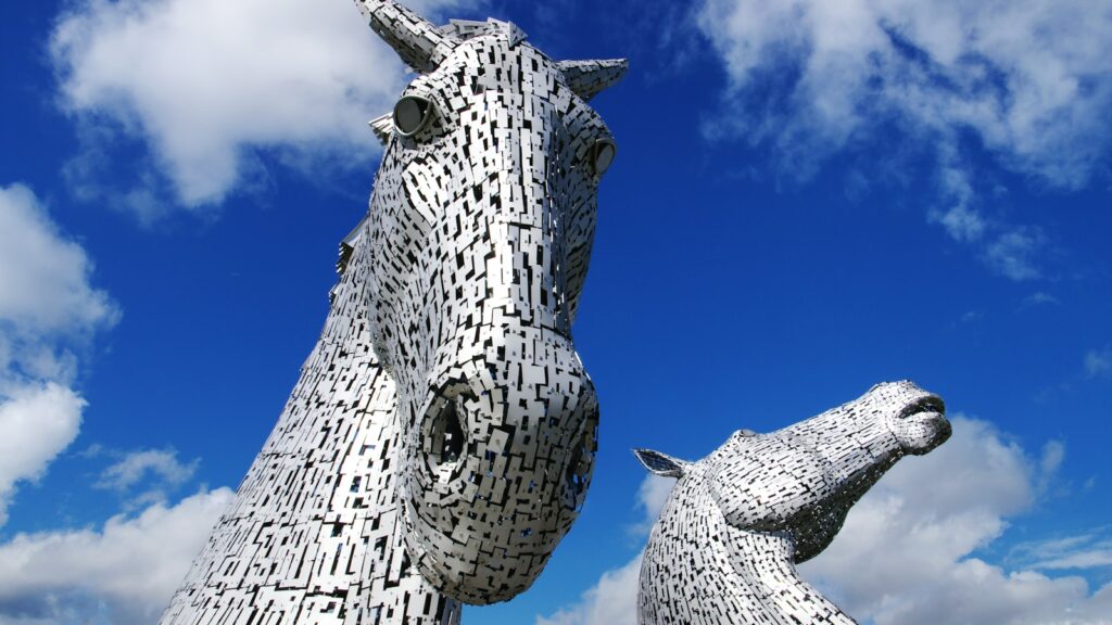 a couple of statues of horses standing next to each other