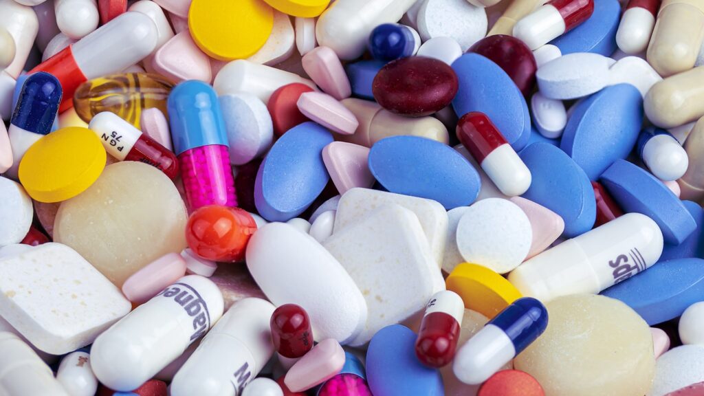 white blue and orange medication pill