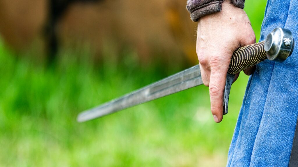 a person holding a knife in their hand
