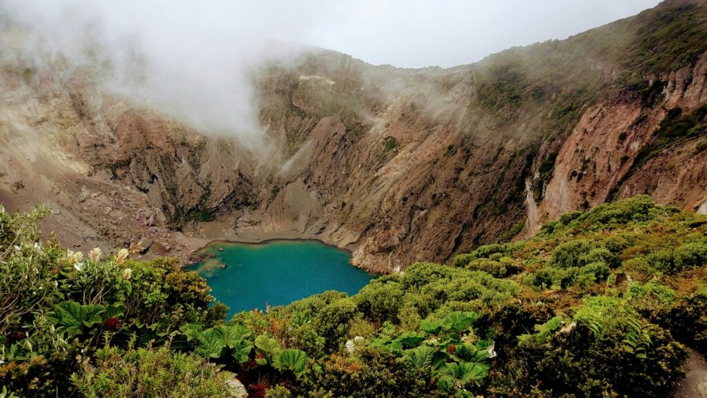 lake at the center of mountain at daytime