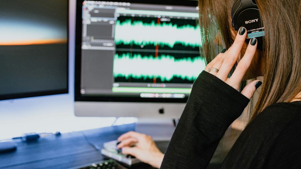 woman in black long sleeve shirt using black laptop computer