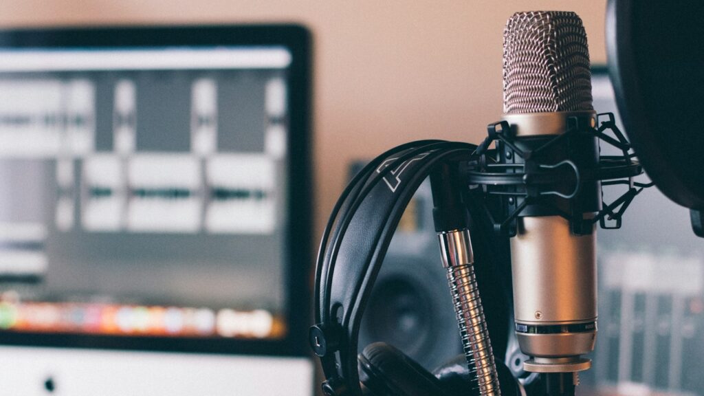 black and silver headphones on black and silver microphone